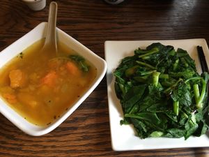 Pumpkin soup and steamed greens at LuAnne's Wild Ginger in New York City
