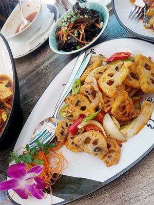 Various dishes, including Fried Lotus Roots (front) and Black Morels in Vinegar Sauce (back) at Tianfuzius in Berlin