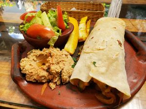 Veggie wrap with yuca fries and hummus at United Falafel Organization in Vilcabamba