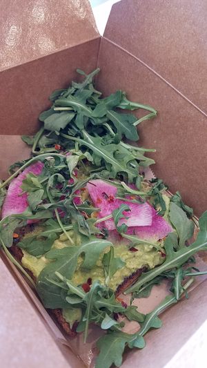 1 slice of avocado toast with watermelon radish, arugula, and chili flakes at Make Out in Culver City