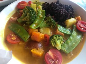 Must have Thai curry, also get the yuca fries cause they are so cheap and so good!!! at Cafe Verde in New Smyrna Beach