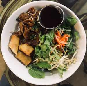 Vermicelli noodles w/ spicy Mongolian flavored chickun, bean sprouts, cucumber, mint, red pepper flakes, and egg roll (vegan) at All Chay in Salt Lake City