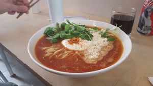The tomato version. My husband said it just tasted like a simple tomato soup. I did not get the chance to try it myself. at Vegan Ramen Shop - Finlandzka in Warsaw