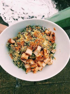 Kale Buffalo Chikin Caesar Salad with house-made smoked coconut bits.  at Naked Cafe in Kelowna