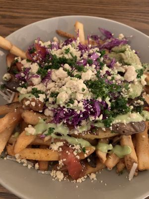 Mushroom Pesto Poutine.   Amazing!!  at Naked Cafe in Kelowna