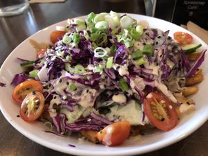 Market Poutine - what a wonderful surprise.  Who knew crunchy raw veggies would go so well with fries, gravy and cheese. at Naked Cafe in Kelowna