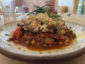 Red pepper & chick pea goulash with bubble & squeak cake & topped with a herby humous   at The Waiting Room in Stockton-on-tees