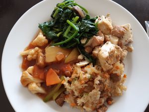 Customers choose 4 items from buffet for approx. $6 USD at Restaurante Delicia in San Jose