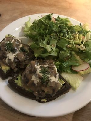 Avocado waffles with creamy mushrooms  at Indigo Age Cafe in Vancouver