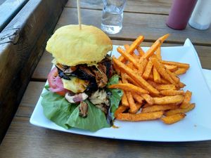 Burger with portobello patty and sweet potato fries at The Vegan Bar in Malmo