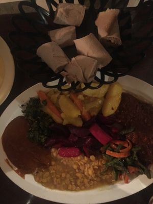 2 person sampler. It is AWESOMELY delicious, but would be so much better with some fresh greens. It was also a bit small for two at that price/quality. at Hawi Ethiopian Restaurant in Ithaca