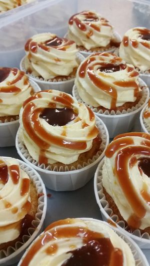 The cupcake sponge contains pureed naturally sundried dark apricots with home-made sweet & salty caramel sauce in the centre.  More is drizzled over the apricot flavoured frosting. at The Free From Bakehouse in London