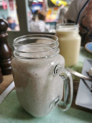 Coconut smoothies, one with hazelnut and banana, one with mango and passion fruit at roots in Thessaloniki