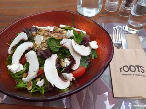 Green salad with tomatoes mushrooms walnuts vegan gorgonzola and basil-lime dressing. Amazing! at roots in Thessaloniki