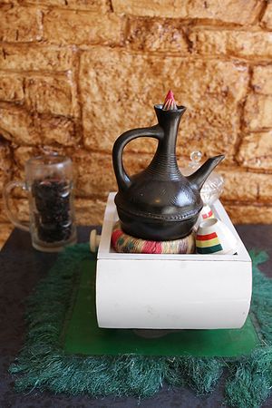Interior of Andu Cafe - Gebena- A traditional container used to brew coffee at Andu Caffe in East London