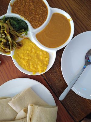 Injera and vegan dish with 5 different toppings. at Andu Caffe in East London