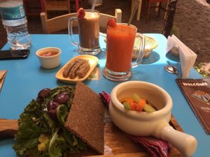 Delicious Brunch, chocolate superfood smoothie,extract 2 ,raw sandwich with raw vegan hummus and veggies. at The Green Patio in Cusco