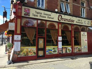 outside at Oranaise Cafe in Leeds