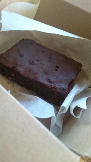 vegan brownie in paper box  at Sugar and Spice in Amsterdam