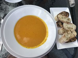 Coconut Carrot Ginger Soup with side of grilled bread  at Chef's Bistro in North Conway