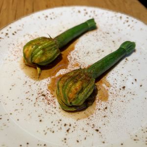 Zucchini flower with pine nut risotto, currants, basil, piquillo peppers & agrodolce  at Transformer Nextdoor in Fitzroy