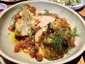 Roast cauliflower, ras-el-hanout, white onion puree, blood orange, hazelnuts & rose harissa  at Transformer Nextdoor in Fitzroy