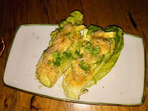 Cos salad w/ avocado, pickled shallot, creamy herb dressing, pangrattato & lemon at Transformer Nextdoor in Fitzroy