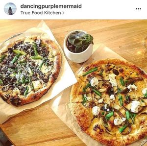 Vegetarian mushroom pizza for my boyfriend and vegan cashew ricotta pizza for me at True Food Kitchen in Atlanta