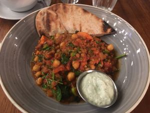 Sweet potato curry with mint dip, pita bread, chickpeas and lentils  at Home Restaurant in Belfast