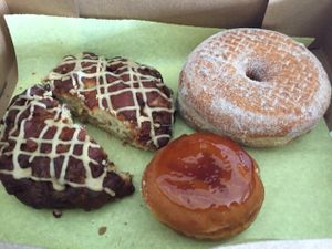 apple fritter, cinnamon sugar, and creme brûlée donuts at Donut Bar in San Diego