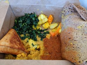 #3 takeout - spicy red lentils, yellow split peas, gommen kale & mixed vegetables with sambusas at Kaffa Ethiopian Cuisine in Berkeley