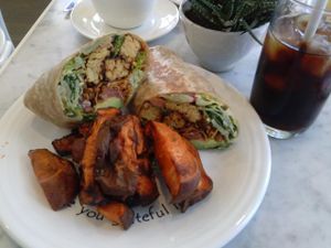 Caesar tempeh wrap with roasted yams at Cafe Gratitude - DTLA in Los Angeles