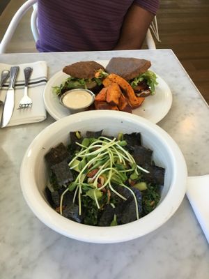 Salad and burger at Cafe Gratitude - DTLA in Los Angeles