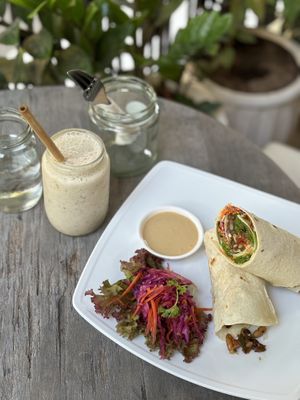 Black bean breakfast wrap & smoothie with dates and almond butter.  at Backyard Cafe - Riverside in Phnom Penh