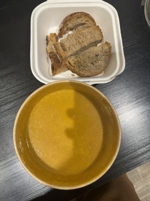 Carrot soup with sourdough bread  at Backyard Cafe - Riverside in Phnom Penh