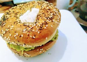 Avocado, tomato & cashew cheese bagel  at Backyard Cafe - Riverside in Phnom Penh