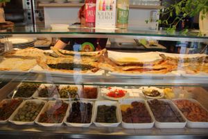 Food display showing vegan Lahmacun, Pide and assorted Antipasti. at Erbils in Munich