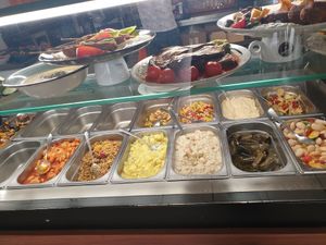 Above the prepared plates, down the cold salad bar at Erbils in Munich