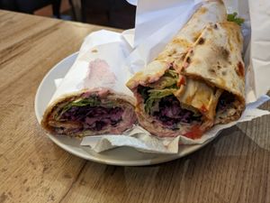 Vegan lahmacun! I've never seen this vegan before. I messed it up a little removing the paper, it looked neater before! at Erbils in Munich