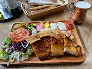 Pide portion with salad and sauces and Ayran at Erbils in Munich