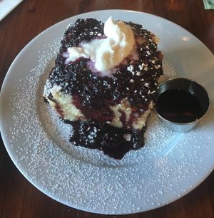 This, this French toast is more like a cinnamon roll soaked in a custard then baked topped with coconut whipped cream and Berry preserves. I died and went to heaven.  at Harvest at The Bindery in Portland
