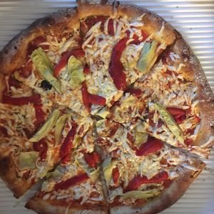 vegan pizza w red peppers garlic and artichokes at Brooklyn Boyz Italian Eatery in Bay City