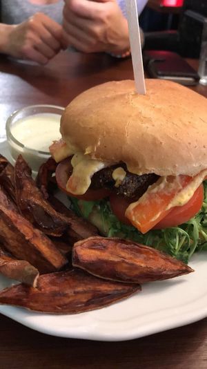 Seitan burger with sweet potato fries at GYVAS baras in Vilnius