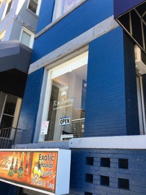 Window with hours at Rise Bakery in Washington