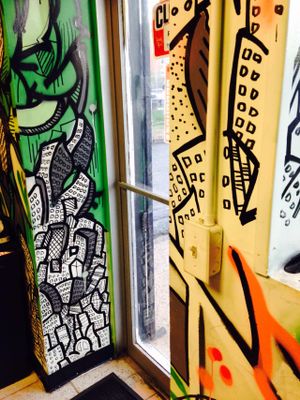 Doors adjacent artwork  at Far East Taco Grille in Washington