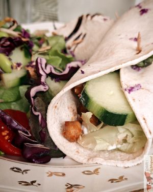Grilled chickpea wrap with oriental spices, tomatoes, cucumbers, salad, “Feta” sauce, chives, lime and raw vegetable salad at Les Demoiselles de Montpellier in Montpellier