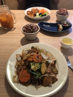 Buddha’s delight foreground and orange chicken background  at Vegan House in Phoenix