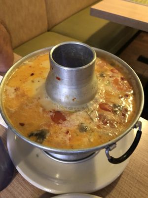 Tom Kha Kai Soup in a bubbling cauldron. at Vegan House in Phoenix