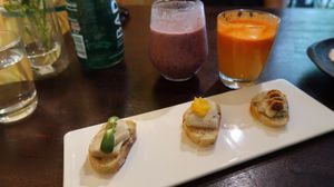 Our juice drinks and the cheese sampler - the fermented vegan cheeses, especially the bleu cheese, were the best we've had! at NAKEDFOOD in Taipei