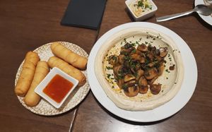 Taqueñas and hummus with grilled mushrooms at Hummus in Barcelona